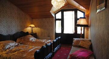 Фото номера Двухместный номер с 2 отдельными кроватями, вид на сад Отель Hotel Villa Antonius г. Наантали 5