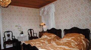 Фото номера Двухместный номер с 2 отдельными кроватями, вид на сад Отель Hotel Villa Antonius г. Наантали 2